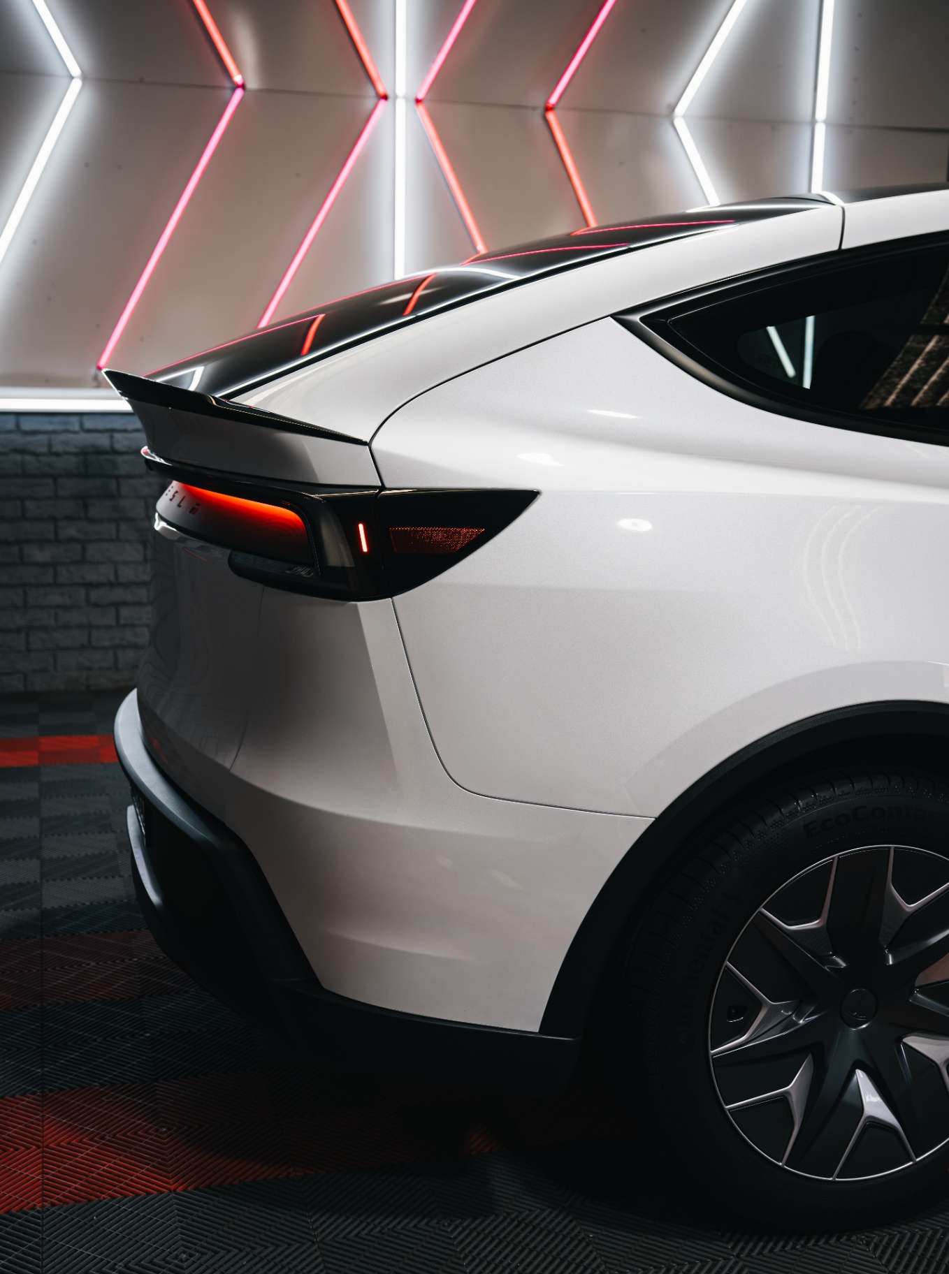 White Tesla Model Y rear quarter with PPF