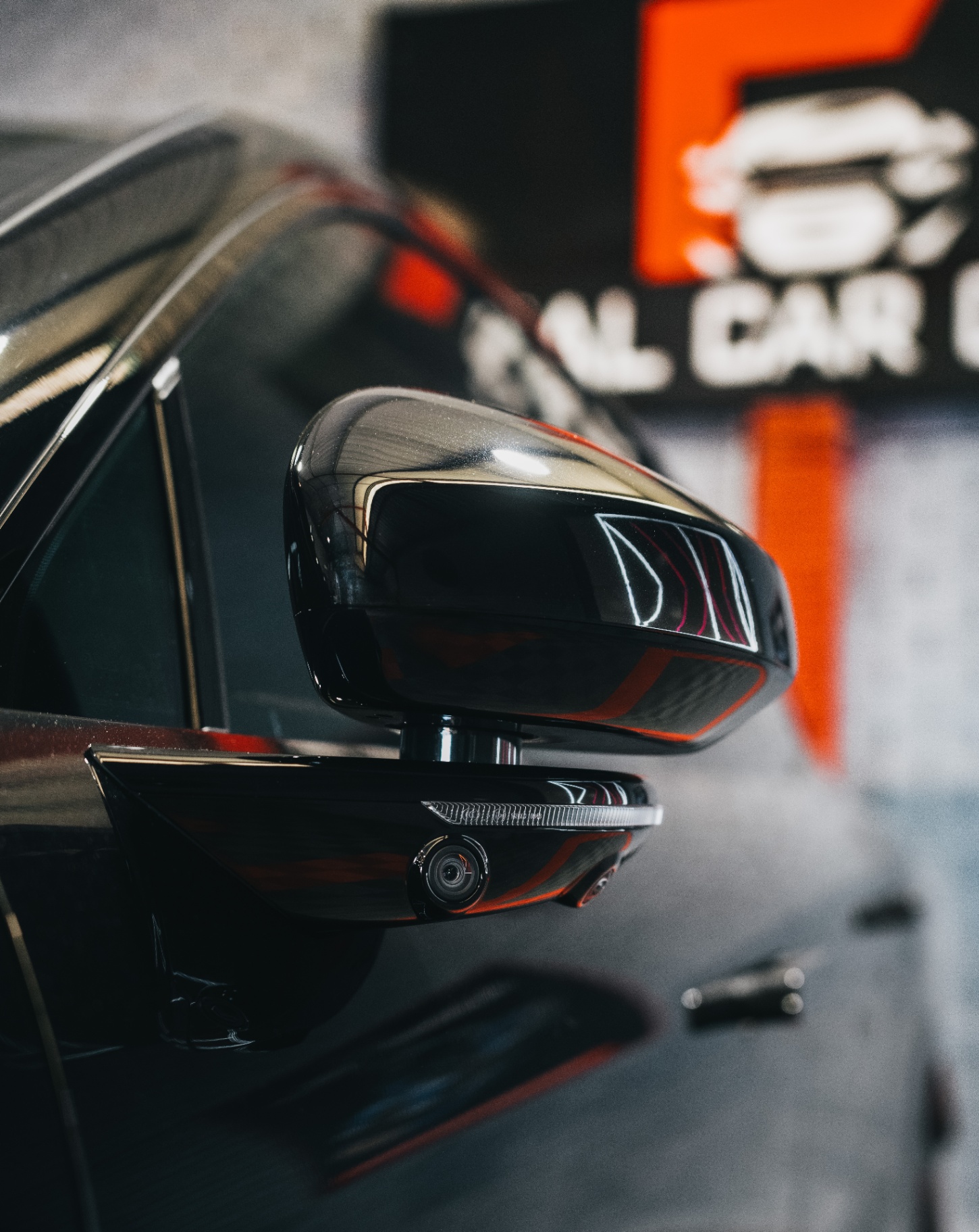 Side mirror detail with camera